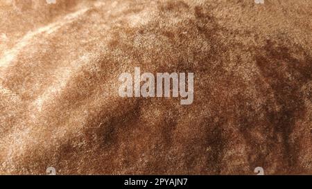 Brown and beige velvet. Close-up. Velvet fabric texture. Irregularities and overflows of light. Deep, rich, chocolate couloured satin. Folded and flowing background. Stock Photo