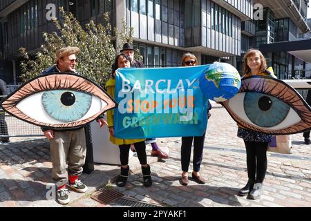 London, England, UK 3rd May 2023 Protesters from a mixture climate and human rights groups including Extinction Rebellion, Fossil Free London and Free Palestine disrupt Barclays AGM. Members of the Climate Choir entered the AGM where they held up proceedings, while protesters dressed as Batman and the Joker held banners outside. Stock Photo