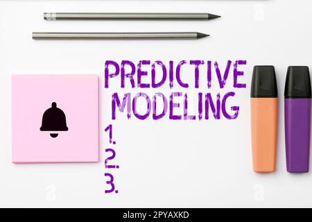 Handwriting text Predictive Modeling. Word for maintenance strategy driven by predictive analytics Stock Photo
