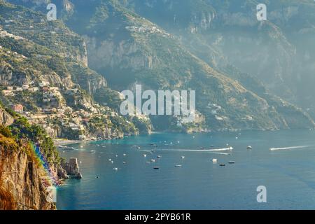Panoramic view of Positano with comfortable beaches and blue sea on Amalfi Coast in Campania, Italy. Amalfi coast is popular travel and holyday destin Stock Photo