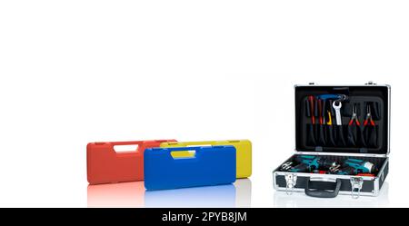 Toolbox isolated on white background. Toolbox with tools. Pliers, spanner or wrench, screwdriver, cutter, and cordless driver drill in tool case. Mechanic hand tools. Blue, orange, and yellow toolbox. Stock Photo