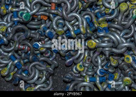 many different types of used iron shackles Stock Photo