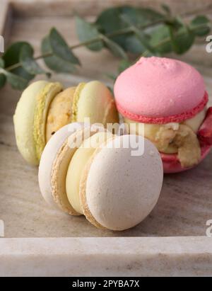 Baked macarons with different flavors on the table, dessert Stock Photo