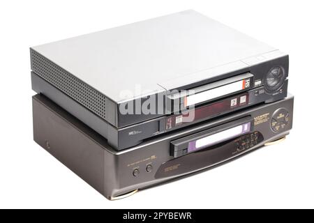 Old video cassette recorder with VHS video tape cassette isolated on white background. Stock Photo