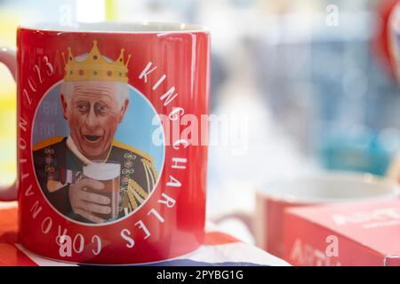 King Charles III Coronation merchandise on sale in a souvenir shop on 25th April 2023 in London, United Kingdom. King Charles II will be crowned King of England on 6th May 2023. Stock Photo