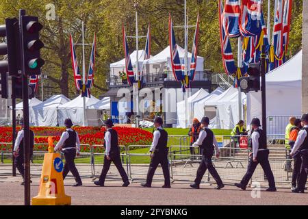 London, UK. 3rd May 2023. Police officers walk past the media area outside Buckingham Palace ahead of the coronation of King Charles III. Credit: Vuk Valcic/Alamy Live News Stock Photo