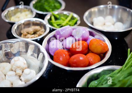 Traditional way of preparing indian food - fresh herbs and spices. Picture of traditional India cooking class in Goa Stock Photo