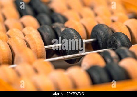 Close-up macro photo of vintage abacus for calculation Stock Photo