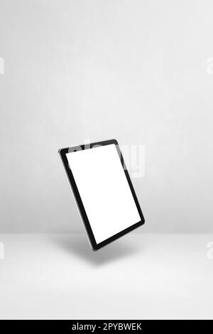 Floating tablet pc computer isolated on white. Vertical background Stock Photo