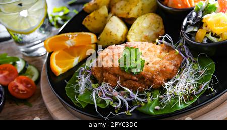 Pulled chicken cutlet coated with breadcrumbs Stock Photo