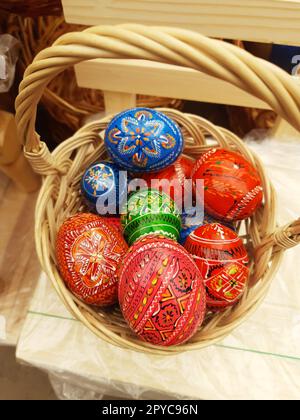 Easter wooden eggs in a basket close-up Stock Photo