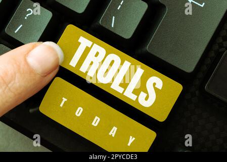 Sign displaying Trolls. Concept meaning Internet slang troll person who  starts upsets people on Internet Stock Photo - Alamy