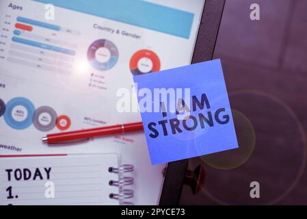 Text caption presenting I Am Strong. Word for Have great strength being healthy powerful achieving everything Stock Photo