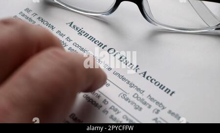 Finger tapping on assignment of bank account Stock Photo - Alamy