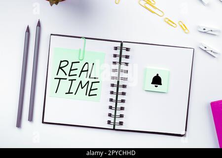 Writing displaying text Real Time. Business overview the actual time during which a processes or events occurs Stock Photo