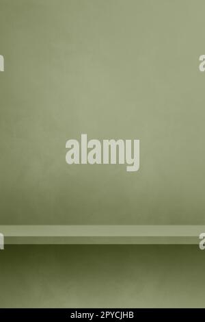 Empty shelf on a khaki green concrete wall. Background template. Vertical mockup Stock Photo