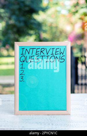 Hand writing sign Interview Questions. Internet Concept Typical topic being ask or inquire during an interview Stock Photo
