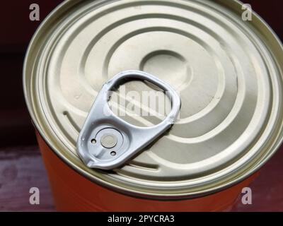 canned food lid with a bottle opener. Hook metal can top for easy opening Stock Photo