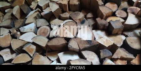 Pile of firewood. Firewood stacked in a woodshed Stock Photo