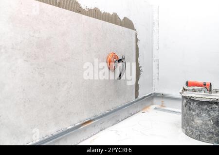 wall tiling with large-format ceramic tiles Stock Photo