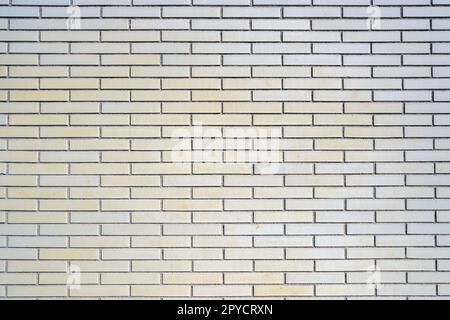 Background from a beige clinkered wall Stock Photo