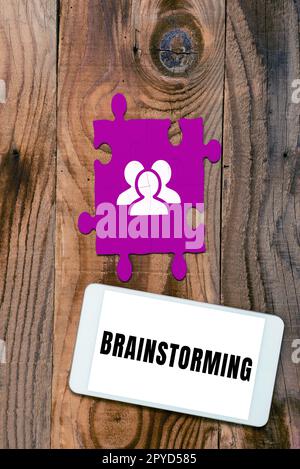 Handwriting text Brainstorming. Concept meaning Hold a group discussion to produce ideas team work Meeting Stock Photo