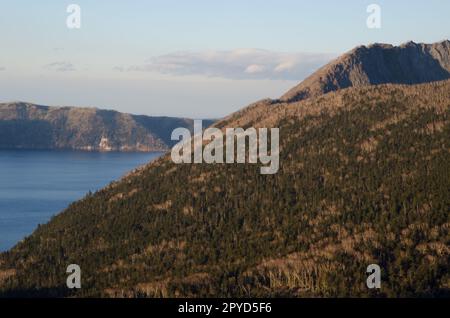 Mount Kamui rising above Lake Mashu. Stock Photo