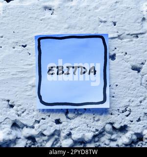 Conceptual caption Ebitda. Word Written on Earnings before tax is measured to evaluate company performance Stock Photo