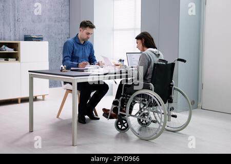Businesswoman ith Disability Sitting On Wheelchair Stock Photo