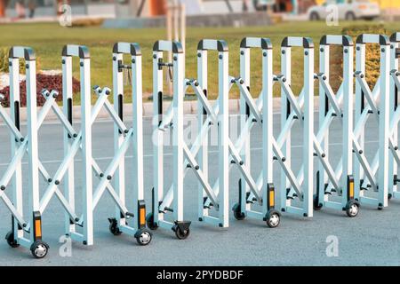 Movable and portable street fence for preventing cars entering police controlled area Stock Photo