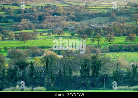 Beautiful peaceful sunny hamlet (isolated hillside houses & cottages on sunlit hill, upland moors) - Addingham Moorside, West Yorkshire, England, UK. Stock Photo