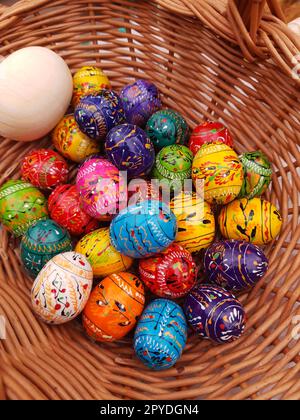Easter wooden eggs in a basket close-up Stock Photo