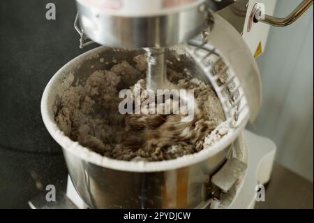 https://l450v.alamy.com/450v/2pydjcw/closeup-for-bread-making-process-by-using-flour-mixing-machine-in-factory-2pydjcw.jpg