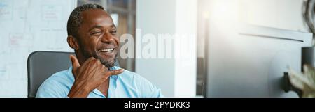 African businessman using sign language while talking online with client sitting in office Stock Photo