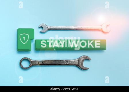 Text sign showing Stay Woke. Internet Concept being aware of your surroundings and things going on Keep informed Stock Photo