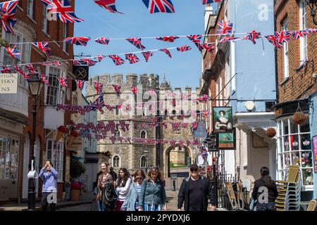 Windsor, Berkshire, UK. 3rd May, 2023. Union Jack bunting flying above a cobbled street outside Windsor Castle. The town of Windsor in Berkshire is gearing up for the Coronation of King Charles III. A star studded concert is to be held in the grounds of Windsor Castle on Sunday 7th May 2023. Credit: Maureen McLean/Alamy Live News Stock Photo