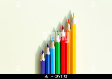 A large number of sharpened colored pencils with falling shadow from natural light on a bright sunny day. Stock Photo