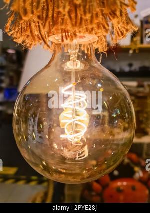 Close-up of a vintage light bulb with soft background. Stock Photo