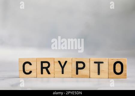 Cryptocurrency stock market concept. Trading on digital exchange in 2022. Virtual money concept. Mining or blockchain technology. wood cubes text crypto 2021 to 2022 on with background. Stock Photo