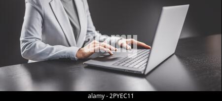 Woman with her laptop in the office and working. Stock Photo