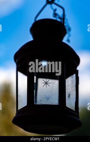 Little lantern with glass and a blurred background Stock Photo