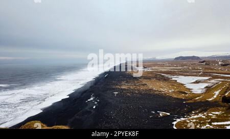 View from Dyrholaey lighthouse in Iceland looking out over the black sand beach. Stock Photo
