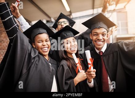 They are proud to be graduating. students on graduation day from university. Stock Photo