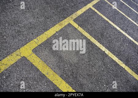 Yellow lines on the asphalt Stock Photo