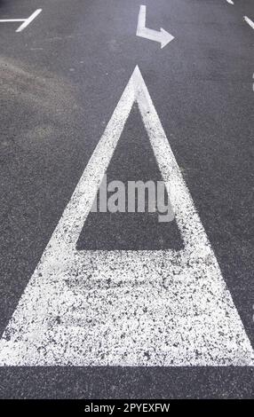 Yield sign on asphalt Stock Photo