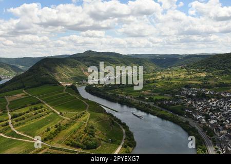 Bird's eye view of a village near the Moselle loop surrounded by greenery and vineyards in Germany Stock Photo