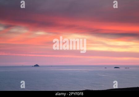 Sunset over Black rock lighthouse in Blacksod bay off the Belmullet peninsula on the Wild Atlantic Way in County Mayo in Ireland Stock Photo