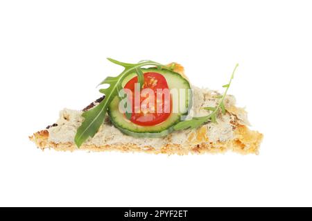 Smoked mackerel pate with salad garnish on a triangle of toast isolated against white Stock Photo