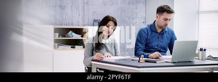 Chartered Accountant In Office With Calculator Stock Photo