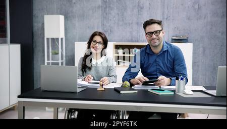 Chartered Accountant In Office With Calculator Stock Photo